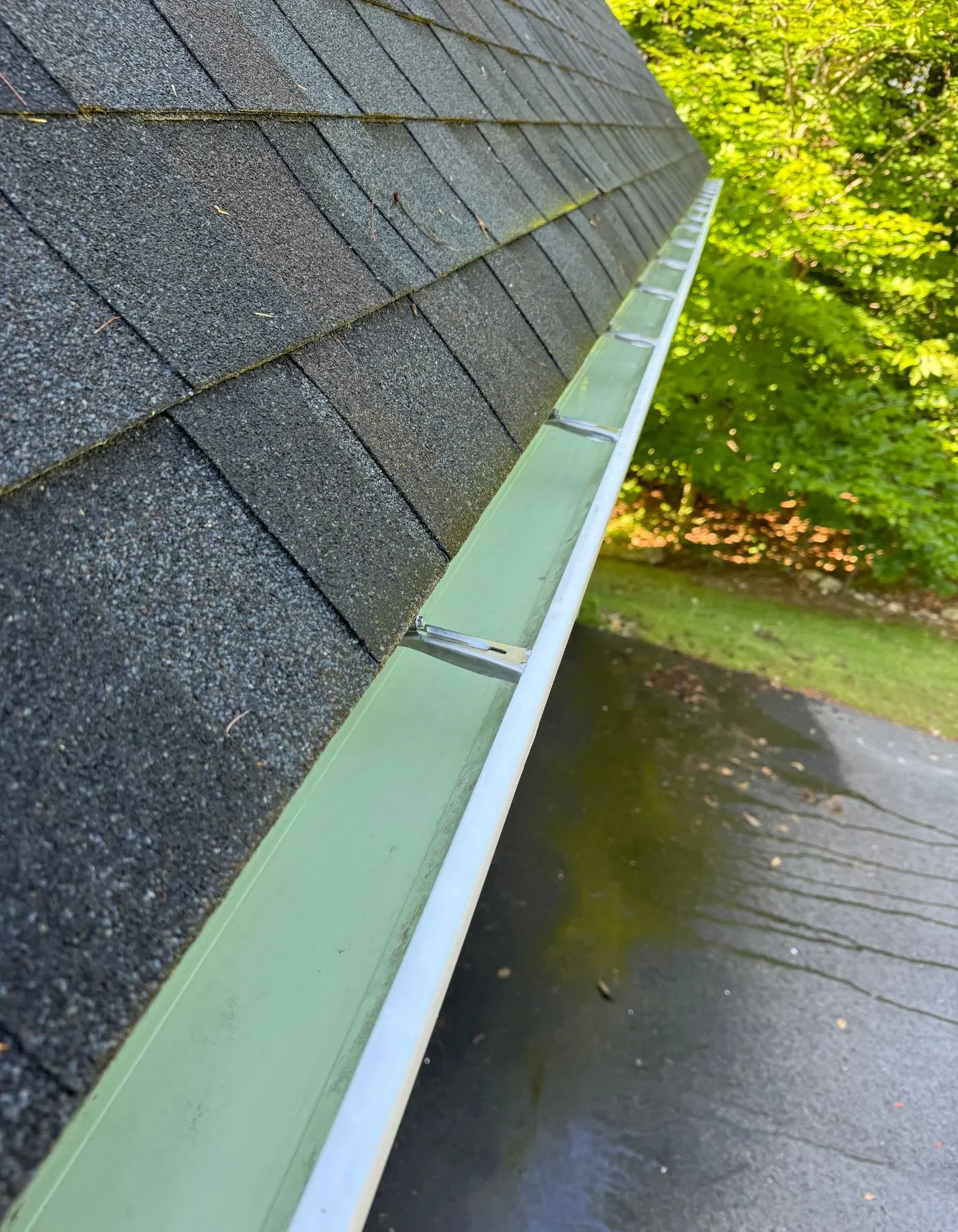 The same gutter cleared and flushed after cleaning